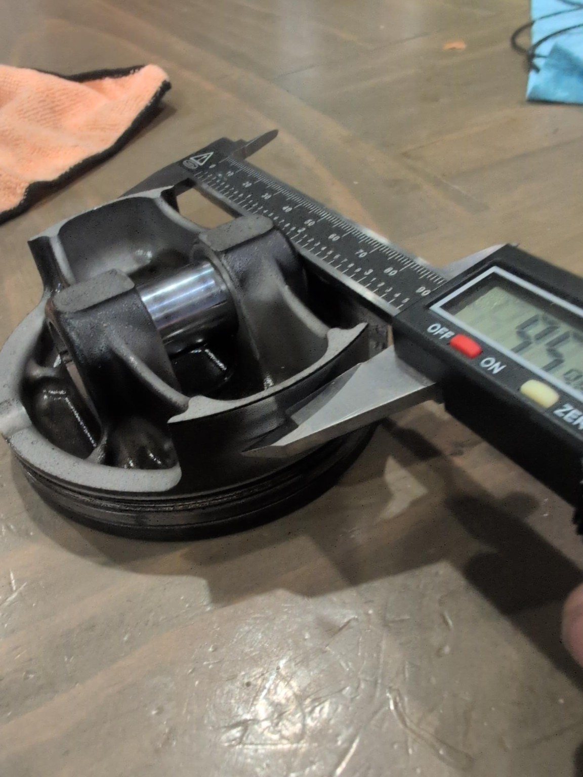 Measuring Honda TRX450 piston with a digital caliper